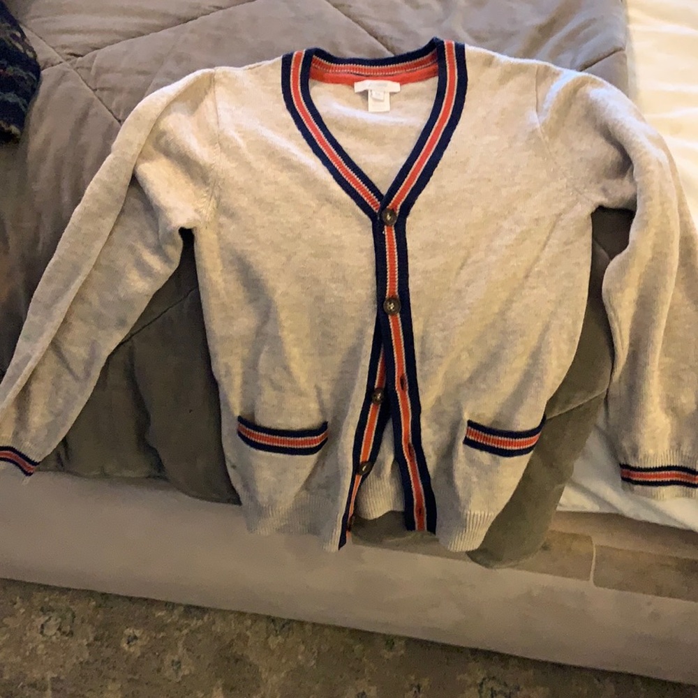Oatmeal cardigan with navy blue and orange stripes on border